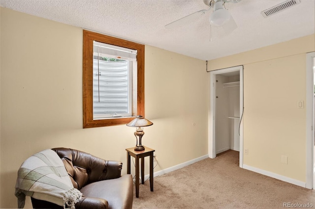 11835 W 37th Pl, Wheat Ridge, CO 80033 - sitting room featuring carpet floors, a ceiling fan, and a textured ceiling