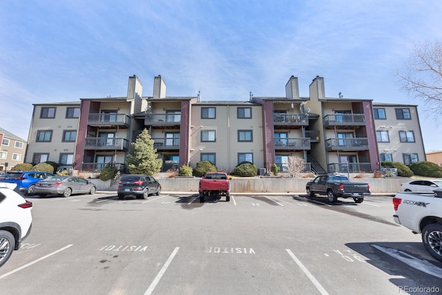 view of property featuring uncovered parking