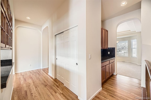 corridor featuring light hardwood / wood-style flooring