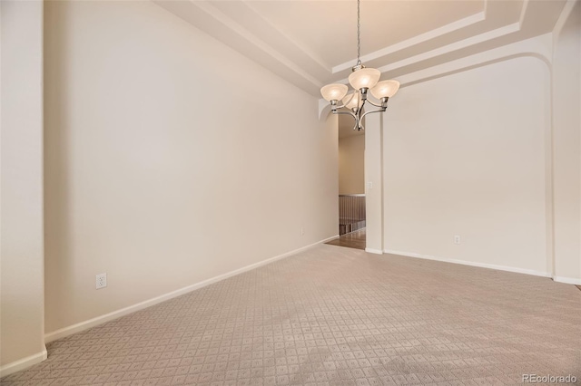 unfurnished room with carpet floors and a chandelier