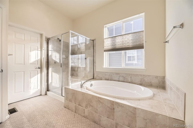 bathroom featuring plus walk in shower