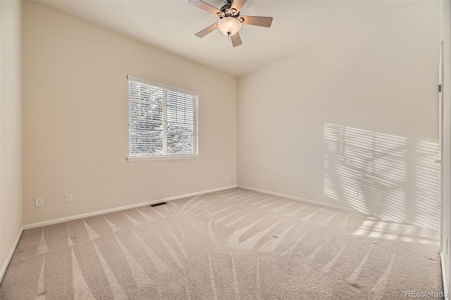 carpeted empty room with ceiling fan