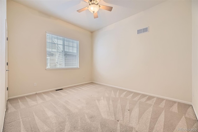 carpeted empty room with ceiling fan