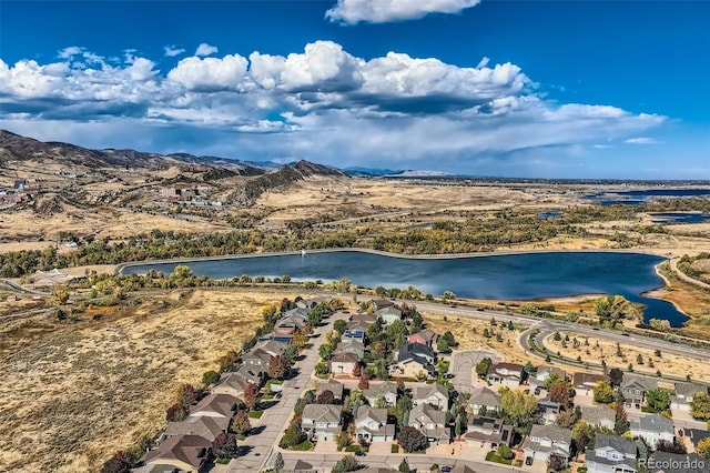 birds eye view of property featuring a water and mountain view