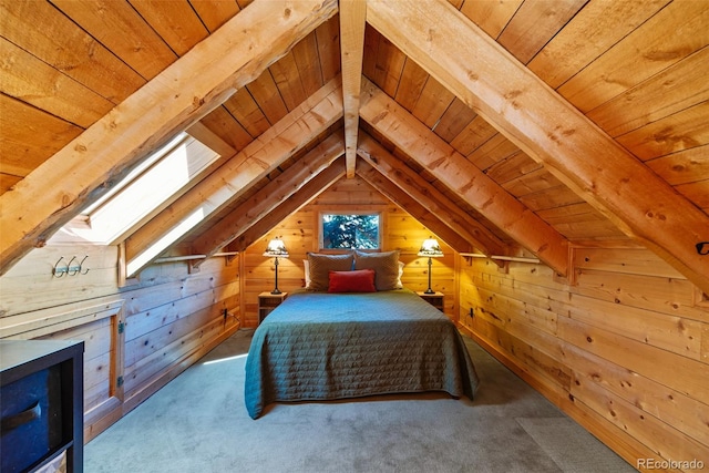 bedroom featuring vaulted ceiling with skylight, wood walls, wooden ceiling, and carpet floors