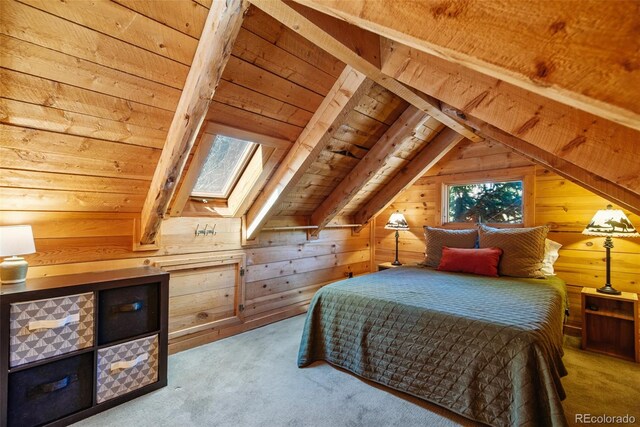 bedroom with wooden walls, carpet floors, wooden ceiling, and lofted ceiling with skylight