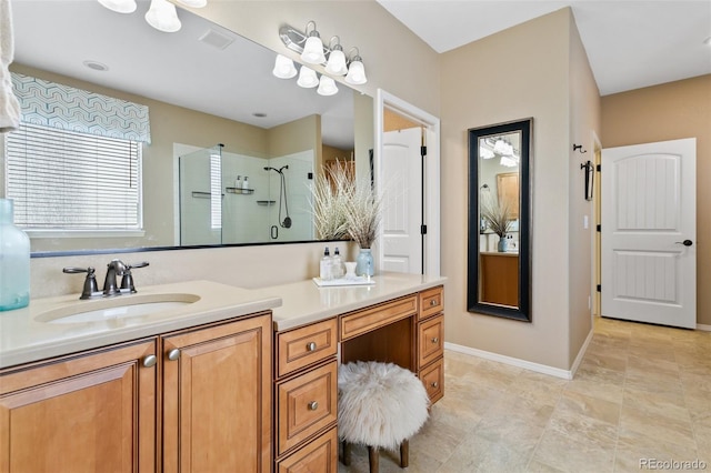 bathroom with vanity and tiled shower