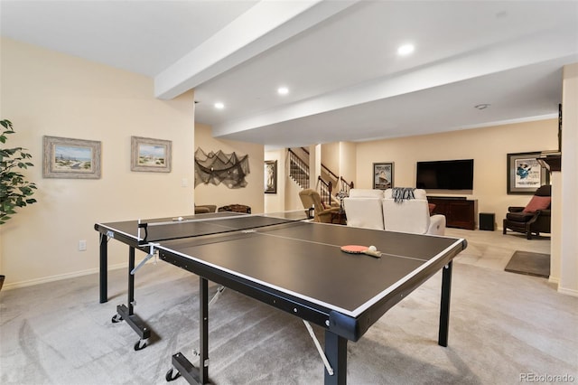 game room featuring beamed ceiling and light carpet