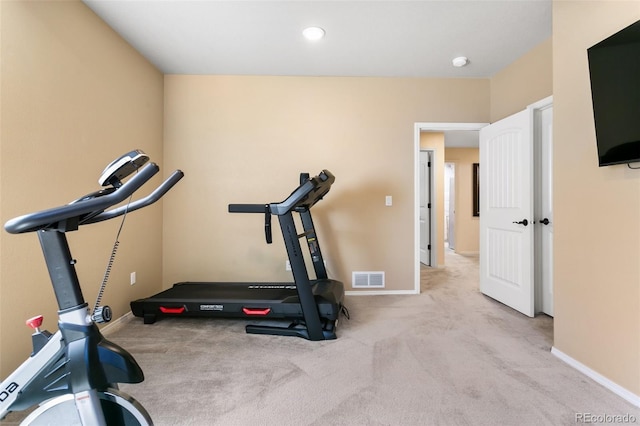 exercise room with light carpet