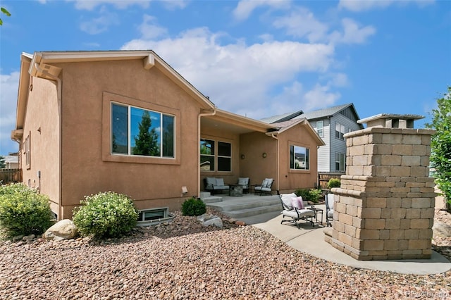 back of house with a patio