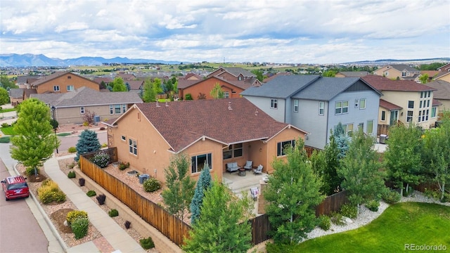 birds eye view of property with a mountain view