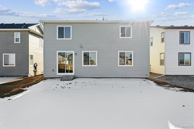 view of snow covered house