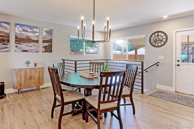 2337 S Franklin St, Denver, CO 80210 - dining room featuring a chandelier and light wood-type flooring