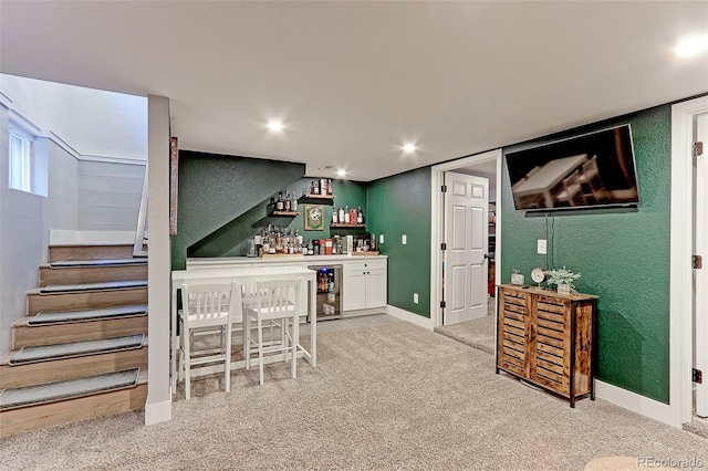 2337 S Franklin St, Denver, CO 80210 - indoor dry bar with light carpet, a textured wall, wine cooler, stairway, and recessed lighting