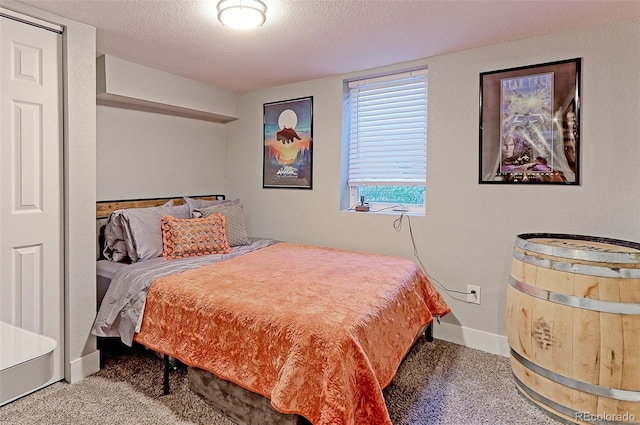 2337 S Franklin St, Denver, CO 80210 - carpeted bedroom featuring a textured ceiling and baseboards