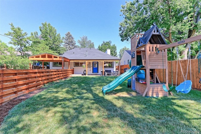 2337 S Franklin St, Denver, CO 80210 - rear view of house with a playground and a fenced backyard
