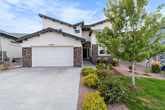 view of front of property with a front yard and a garage