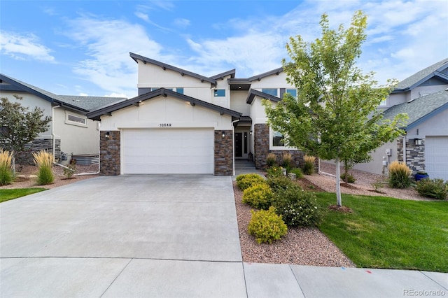 view of front of house featuring a garage and a front yard