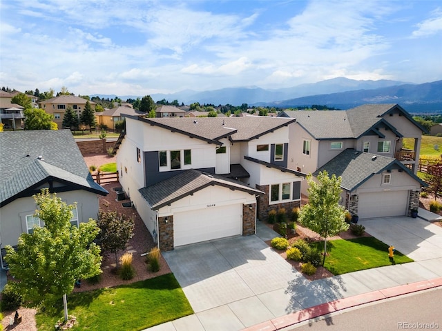 view of front of house with a garage and a mountain view