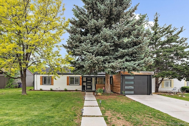 2865 S Cherry Way, Denver, CO 80222 - view of front of home featuring a front lawn, driveway, and a garage