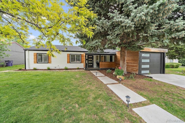 2865 S Cherry Way, Denver, CO 80222 - view of front of home featuring a front yard, driveway, and an attached garage