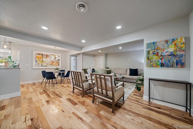 2865 S Cherry Way, Denver, CO 80222 - living area featuring light wood-style floors, recessed lighting, and baseboards