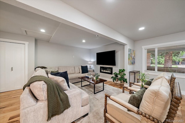 2865 S Cherry Way, Denver, CO 80222 - living room with light wood finished floors, recessed lighting, and baseboards