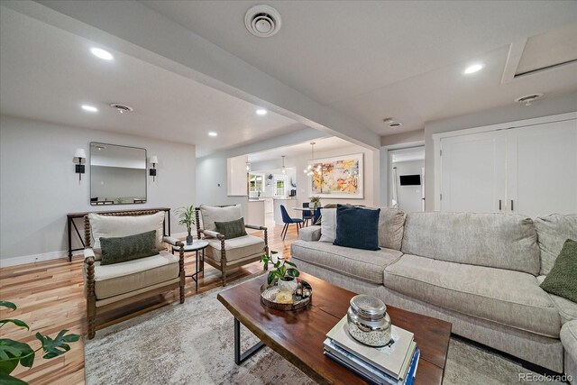 2865 S Cherry Way, Denver, CO 80222 - living room featuring light wood finished floors, baseboards, and recessed lighting