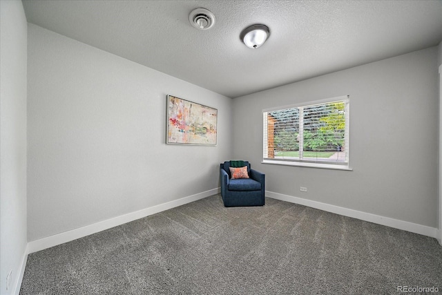 2865 S Cherry Way, Denver, CO 80222 - unfurnished room with carpet floors, baseboards, and a textured ceiling