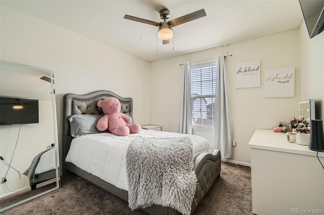 bedroom featuring ceiling fan and dark carpet