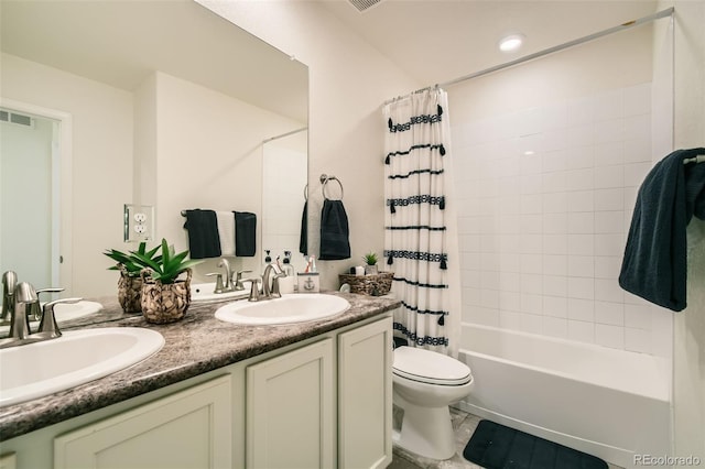 full bathroom featuring shower / tub combo with curtain, visible vents, a sink, and toilet