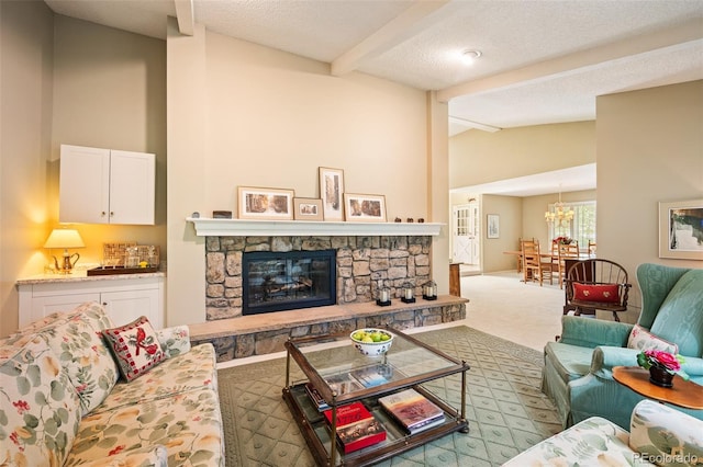 living room with a fireplace, lofted ceiling with beams, light colored carpet, and a textured ceiling