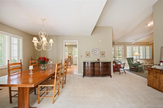 dining room featuring beam ceiling, light carpet, and a notable chandelier