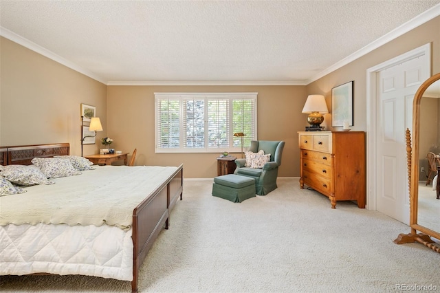 carpeted bedroom with ornamental molding and a textured ceiling