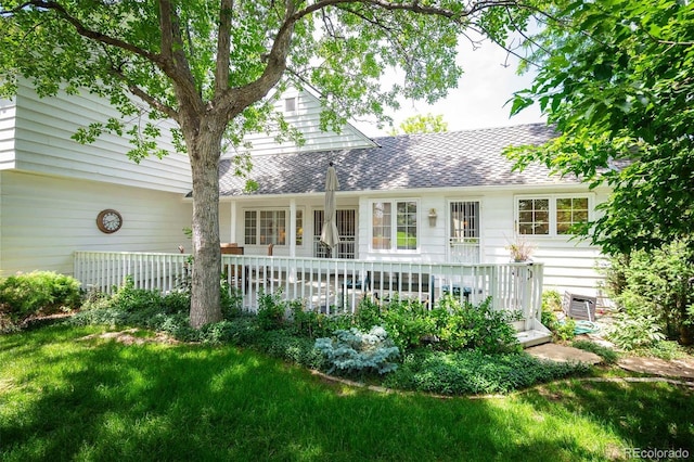 rear view of house with a lawn