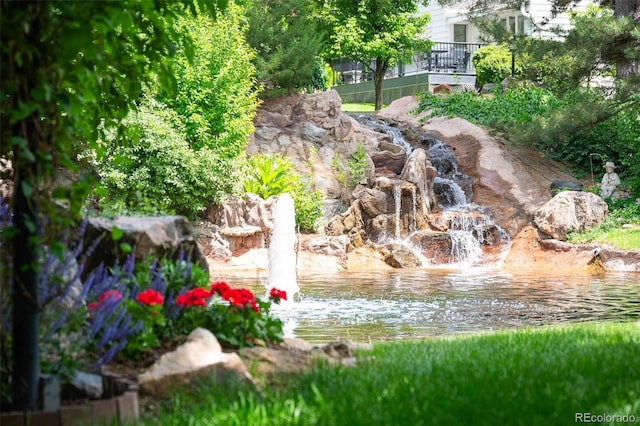 surrounding community featuring a water view