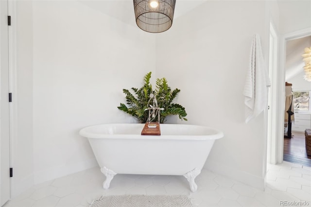 700 Apple Ridge Rd, Lyons, CO 80540 - bathroom with a soaking tub, baseboards, and tile patterned flooring