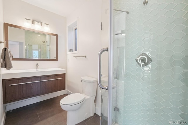 700 Apple Ridge Rd, Lyons, CO 80540 - bathroom featuring a stall shower, vanity, toilet, and tile patterned floors