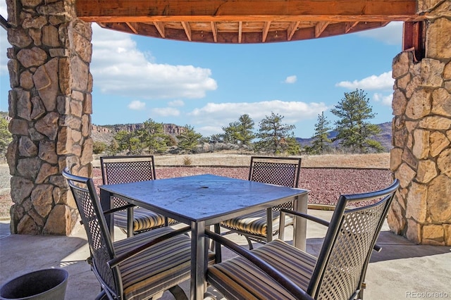 700 Apple Ridge Rd, Lyons, CO 80540 - view of patio / terrace featuring outdoor dining space and a mountain view