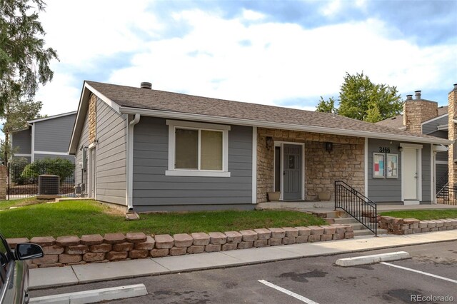 ranch-style house with a front lawn