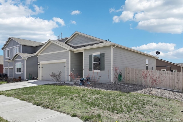 310 Quincy Rr Ave, Keenesburg, CO 80643 - view of front of property featuring a front lawn, concrete driveway, fence, a garage, and a shingled roof