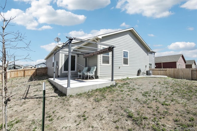 310 Quincy Rr Ave, Keenesburg, CO 80643 - back of property featuring a patio area and a fenced backyard