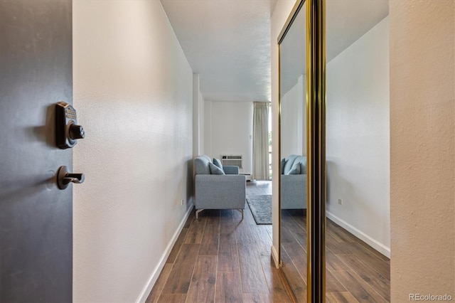 7801 W 35th Ave Unit 1, Wheat Ridge, CO 80033 - hallway featuring dark wood finished floors, a wall unit AC, and a textured wall
