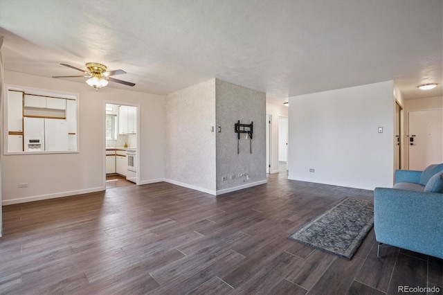 7801 W 35th Ave Unit 1, Wheat Ridge, CO 80033 - unfurnished living room featuring ceiling fan and dark wood-type flooring