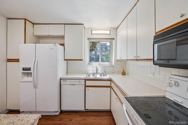 7801 W 35th Ave Unit 1, Wheat Ridge, CO 80033 - kitchen with white appliances, light countertops, and decorative backsplash