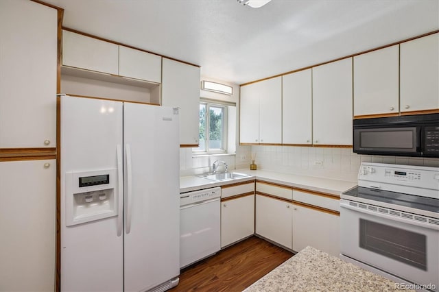 7801 W 35th Ave Unit 1, Wheat Ridge, CO 80033 - kitchen featuring white appliances, dark wood-style flooring, and light countertops