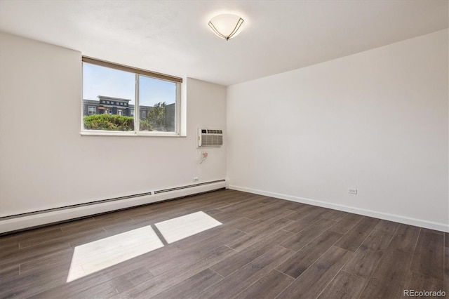 7801 W 35th Ave Unit 1, Wheat Ridge, CO 80033 - empty room with a baseboard radiator, wood finished floors, and a wall mounted air conditioner