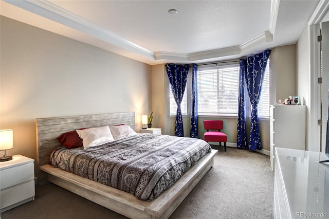 bedroom with a raised ceiling, ornamental molding, carpet, and baseboards