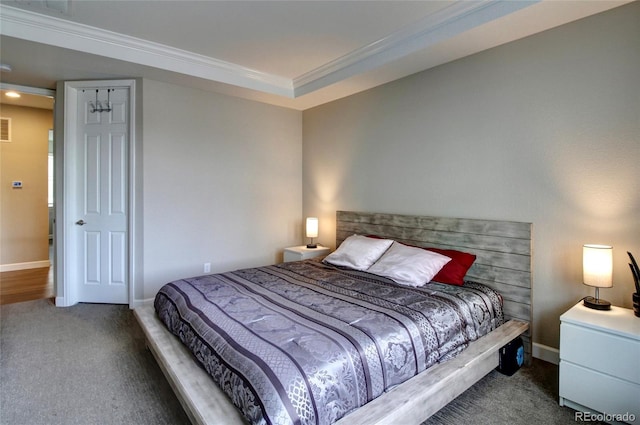 carpeted bedroom with crown molding, baseboards, and visible vents