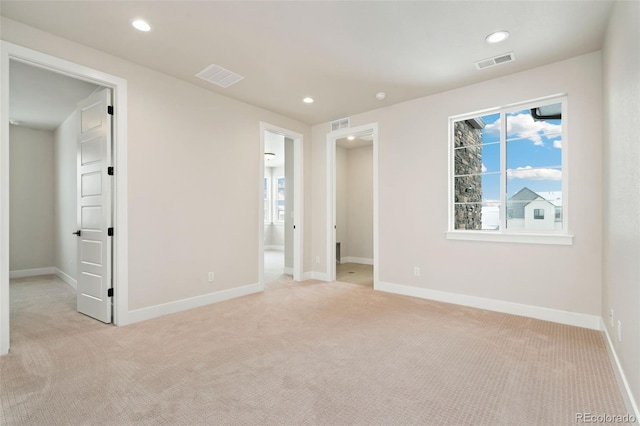 unfurnished bedroom with light carpet